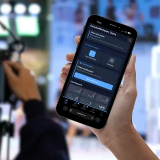 BadgeMe networking screen on a phone at a conference